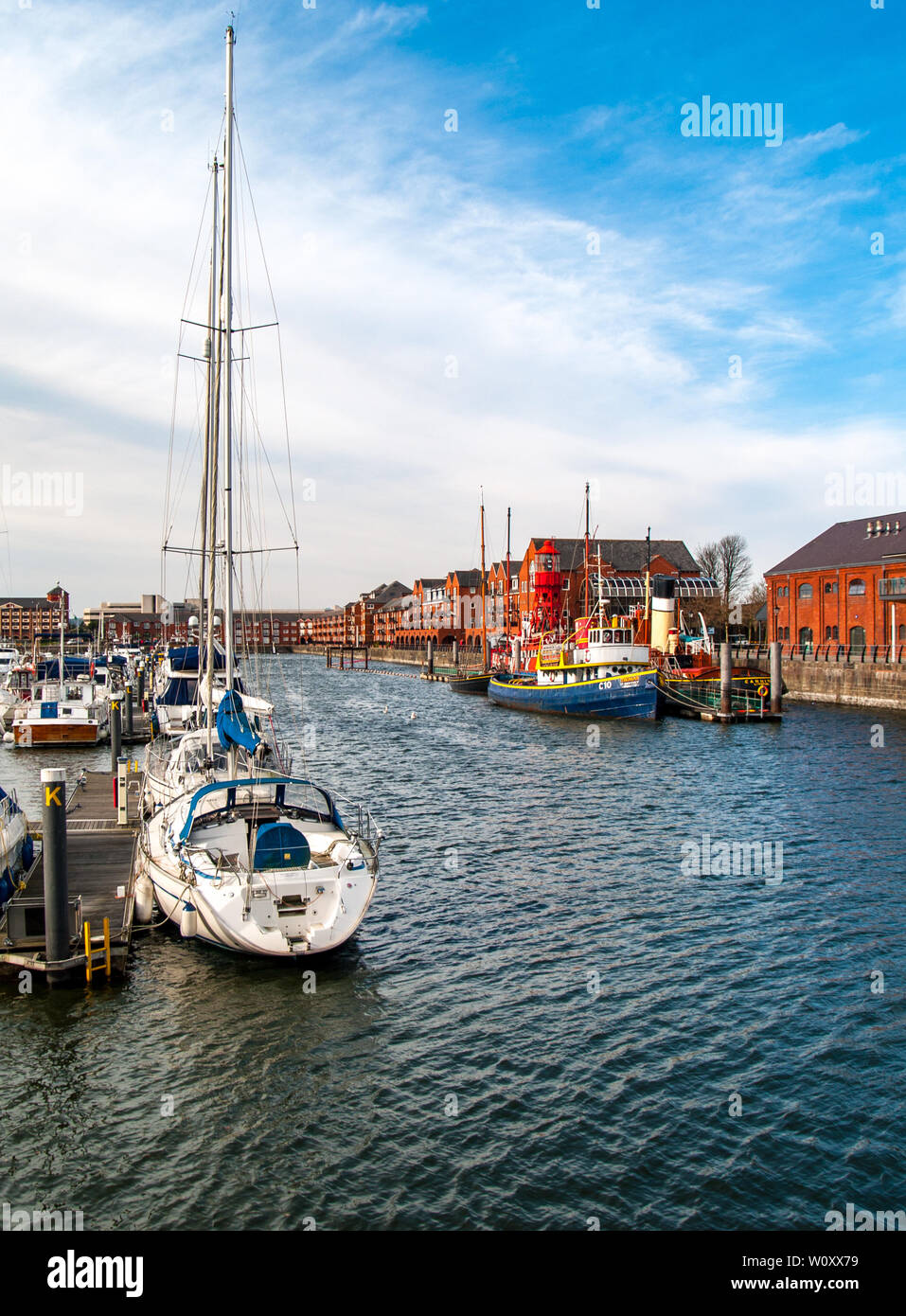 Boats, yachts and ships moored in Swansea Marina. Looking towards the National Waterfront Museum. Swansea, Wales, UK. Stock Photo