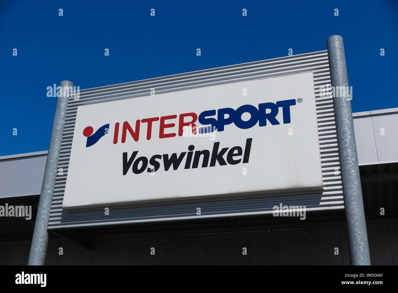 TOENISVORST, GERMANY - JUIN 28. 2019: Close up of logo against blue sky of  Intersport Vosswinkel (German chain for sports supplies Stock Photo - Alamy
