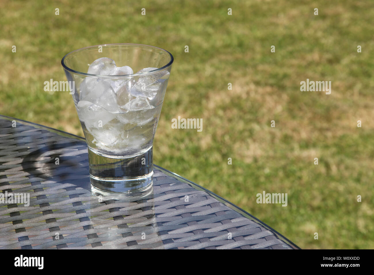 Ice melting concept Part of a Series of images 3of7 showing glass of