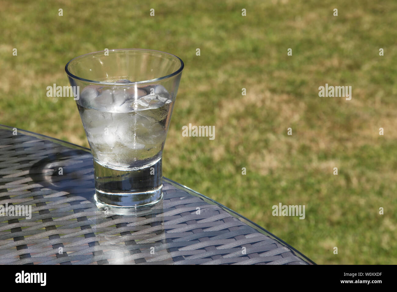 Ice melting concept - Part of a Series of images 4of7 showing glass of ...