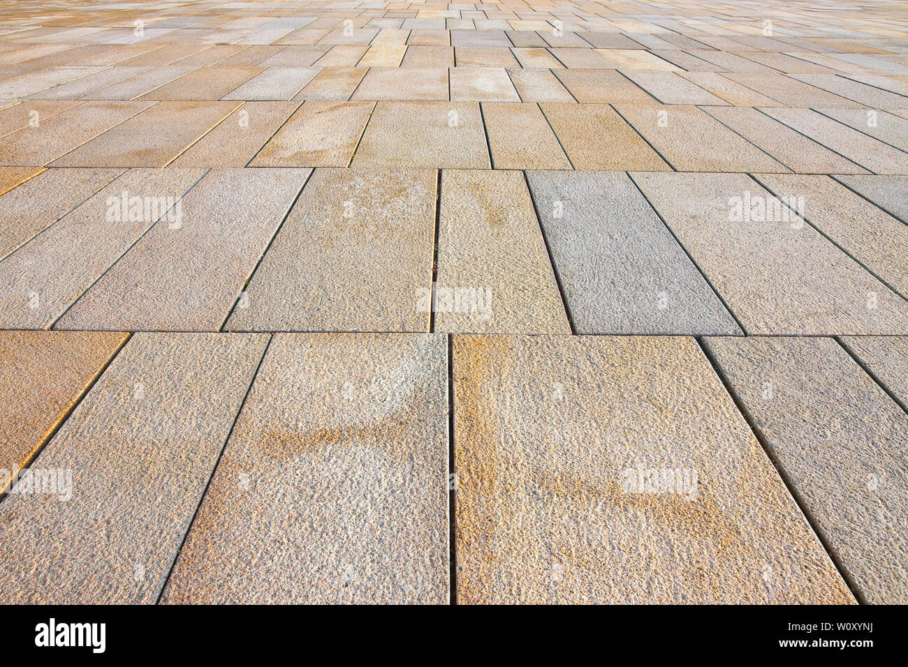 New paving made with stone blocks of rectangular shape in a pedestrian ...