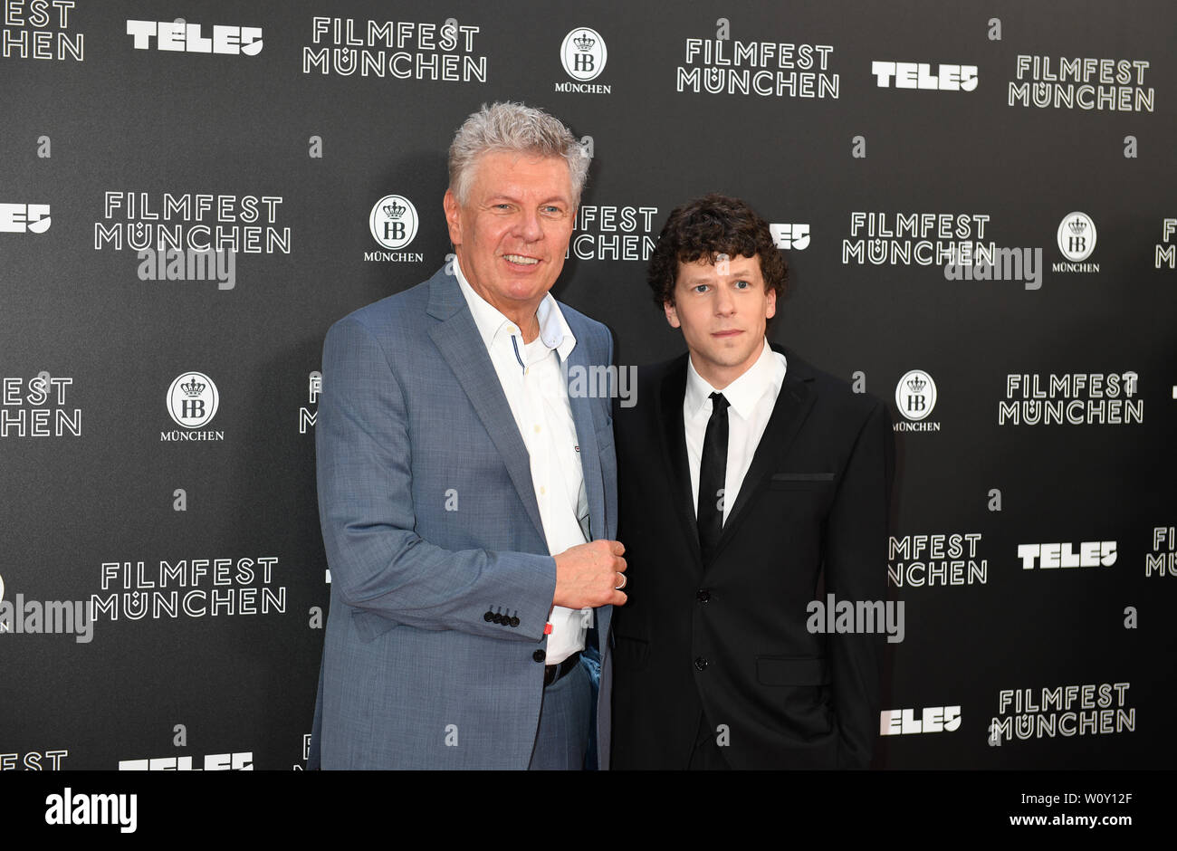 Munich, Germany. 27th June, 2019. Director Riley Stearns (r) and actor  Jesse Eisenberg are standing on the red carpet of the Filmfest Munich,  which opens with the comedy The Art of Self-Defense
