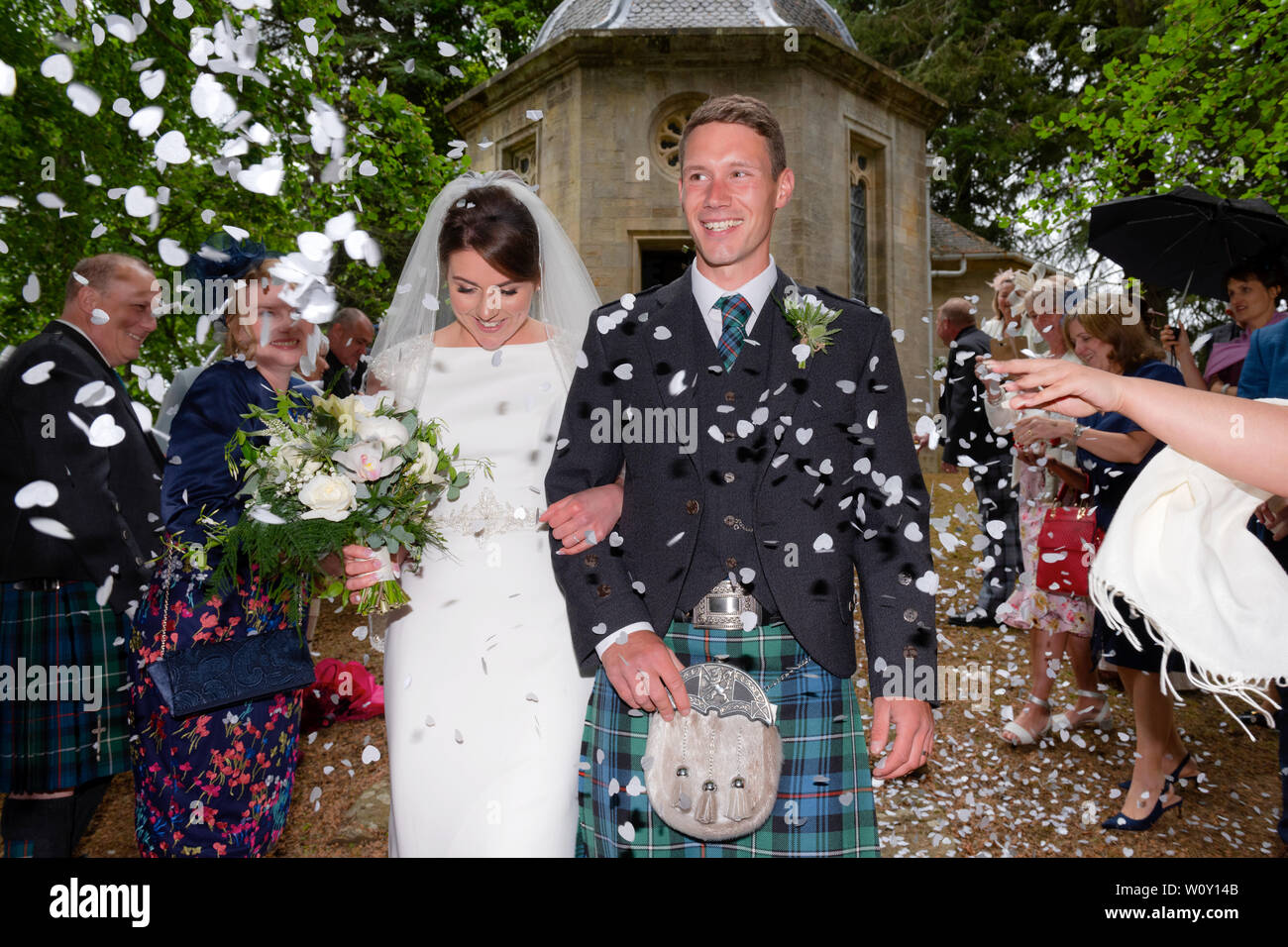 A bride and groom from a Scottish wedding which took place on the Belladrum Estate, Kiltarlity, Inverness-shire. Stock Photo