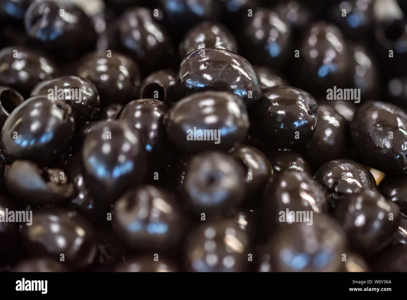 Canned black pitted olives for abstract background Stock Photo Alamy