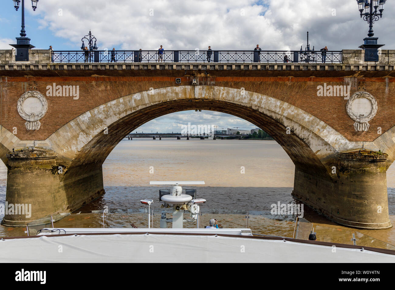 Approaching the 1822 Pont de Pierre, or Stone Bridge, in Bordeaux. Famous for it's 17 arches, the same number as letters in Napoleon Bonaparte. Stock Photo