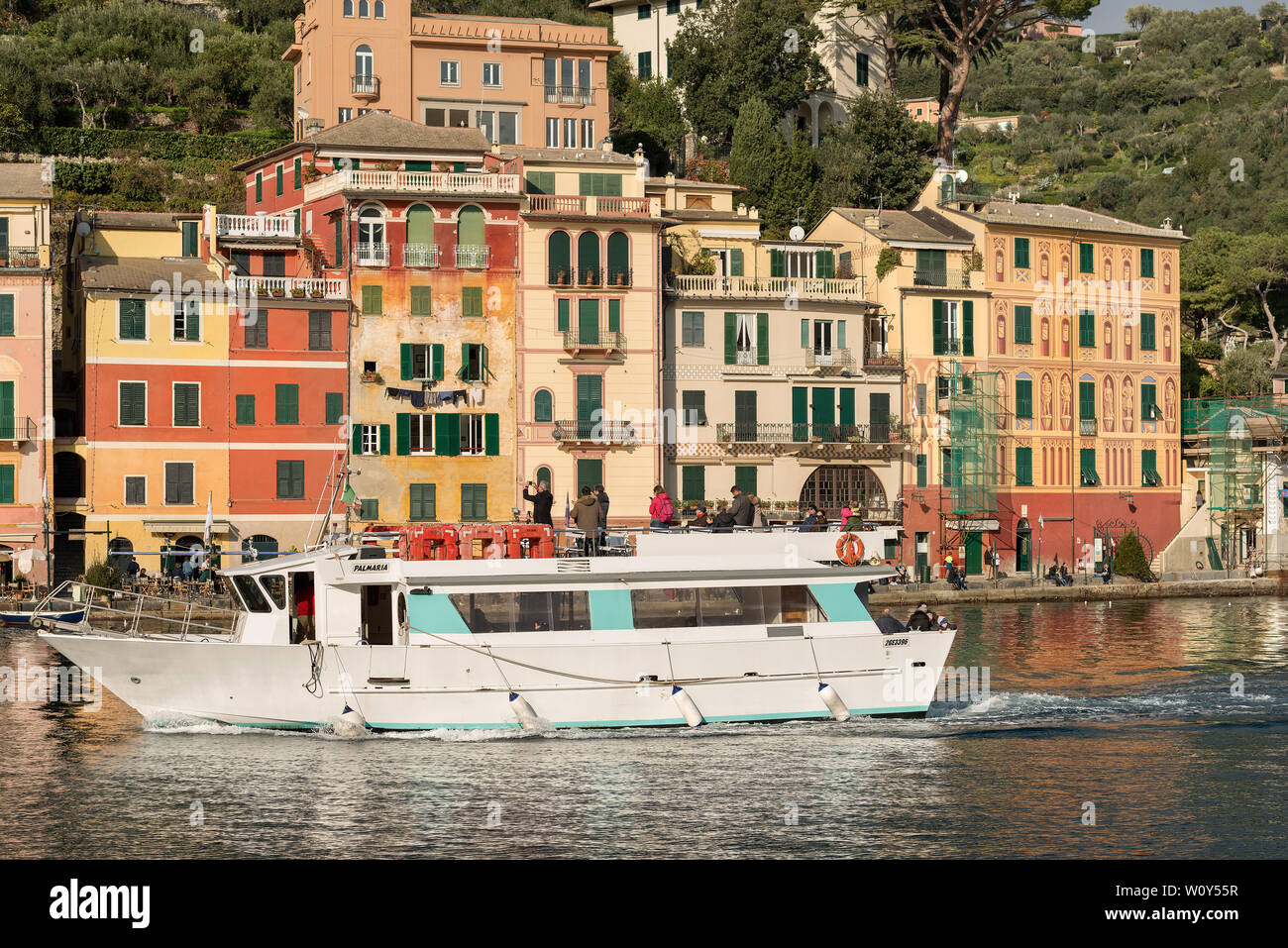 Tourists on a ferry boat photographing the ancient village of Portofino  with the colorful houses. Genova, Liguria, Italy, Europe Stock Photo - Alamy
