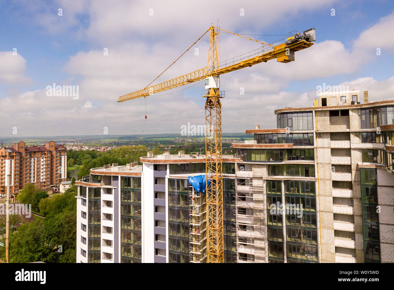 Apartment or office tall building under construction. Brick walls