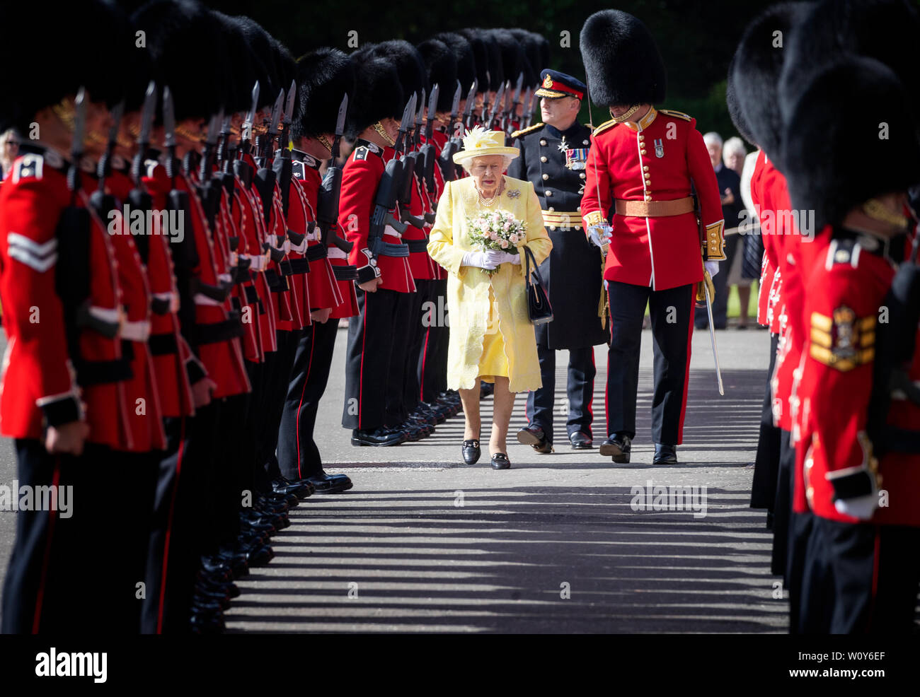 Queen Elizabeth II inspects the Guard of Honour, F Coy Scots Guards, during the Ceremony of the