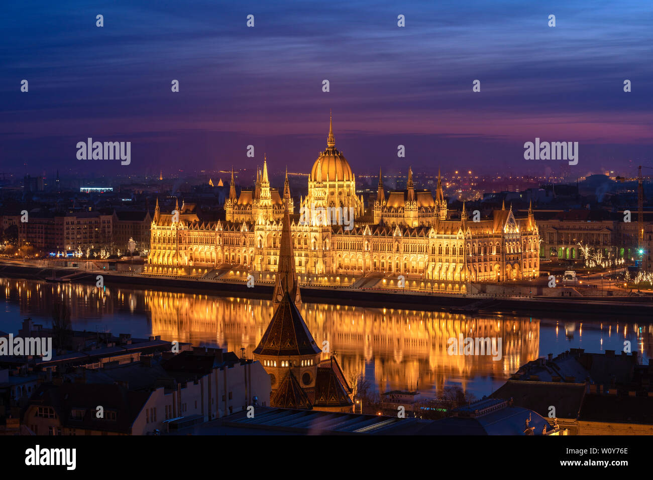 Dawn colours over the Parliament building reflection in the The River Danube, Budapest, Hungary. Stock Photo