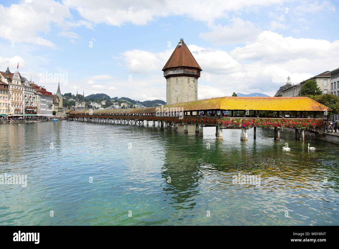 Lucerne Switzerland. Travel picture of landmark tourist attraction Kapellbrucke Chapel Bridge and Wasserturm water tower, Reuss River, Luzern. Stock Photo