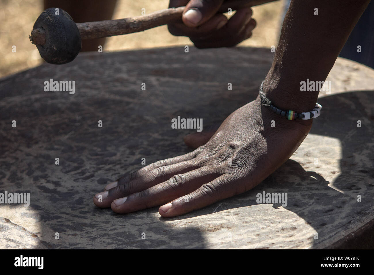 Traditional African drum from being played with drum stick mallet Stock