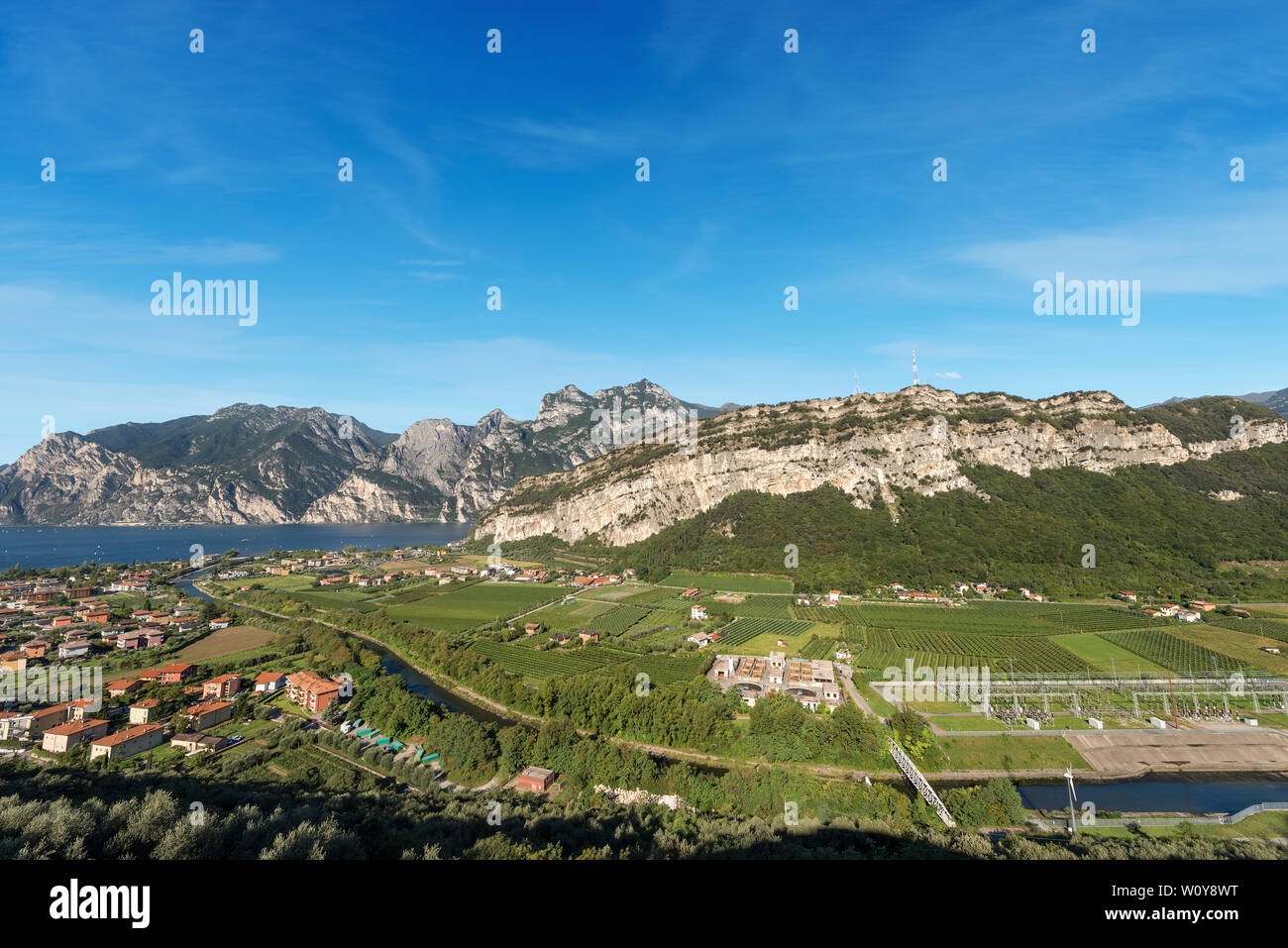 Aerial view of the Lake Garda with the small town of Nago Torbole and the Sarca valley in summer. Trentino Alto Adige, Italy, Europe Stock Photo
