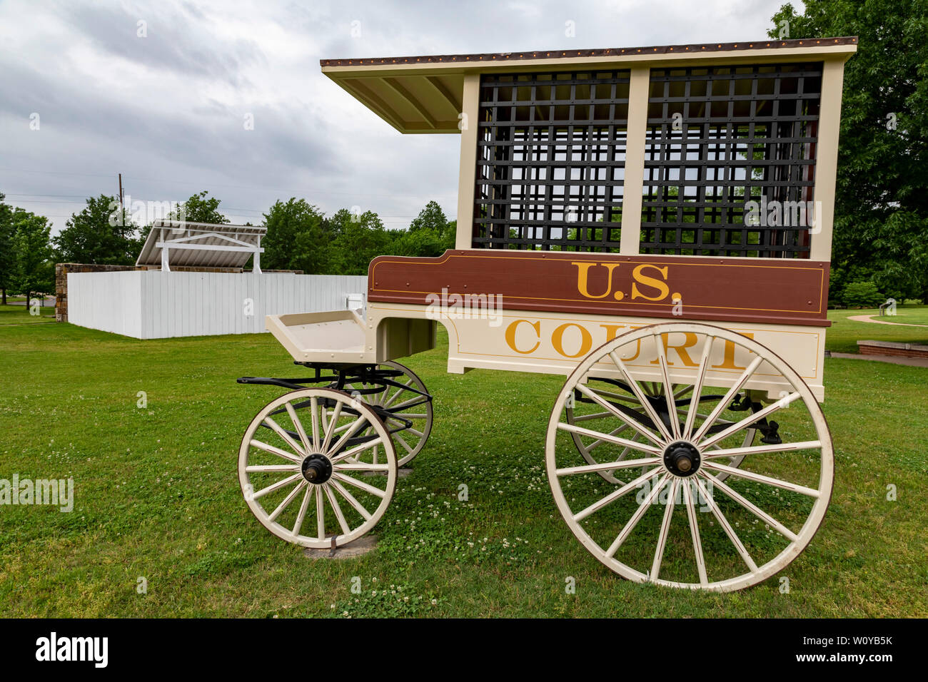 Fort Smith, Arkansas - A wagon for transporting prisoners at Fort Smith National Historic Site. The gallows, where 86 were hanged between 1873 and 189 Stock Photo