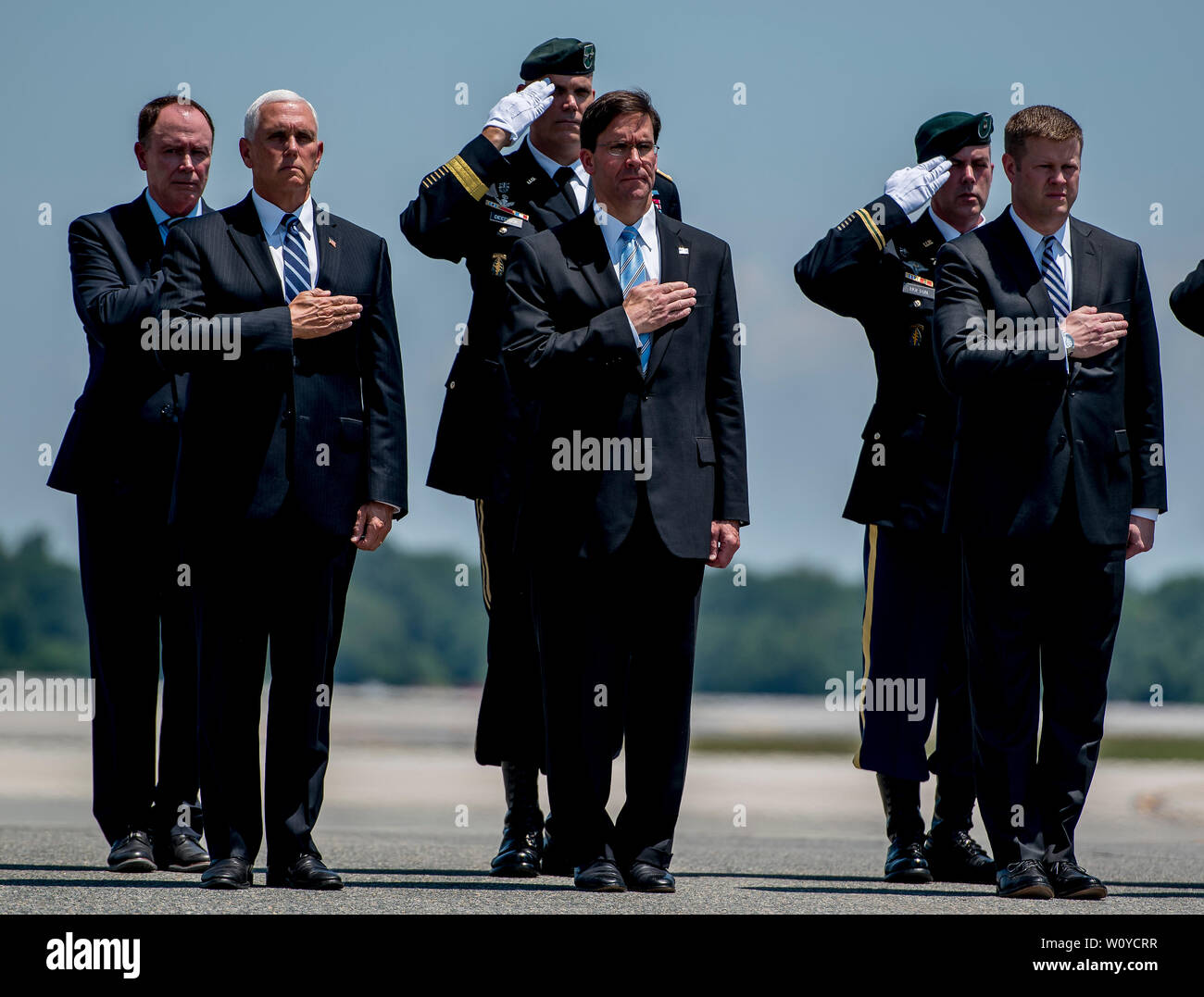 Dover, DE, USA. 28th June, 2019. June 28, 2019 : The official party salutes the transfer case during the dignified transfer of Sergeant James G. Johnston, of Trumansburg, New York, at Dover Air Force Base. The solemn ceremony was attended by numerous dignitaries including Vice President Mike Pence, Acting Secretary of Defense Dr. Mark Esper and Acting Secretary of the Army Ryan McCarthy. Scott Serio/ESW/CSM/Alamy Live News Stock Photo