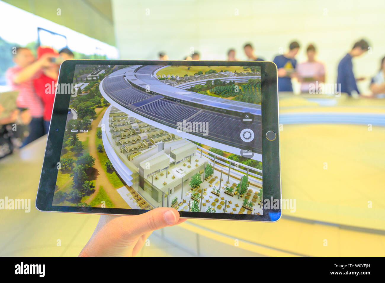 Cupertino, CA, United States - August 12, 2018: details of iPad with virtual reality program showing the new Apple HQ Offices with campus at the Apple Stock Photo