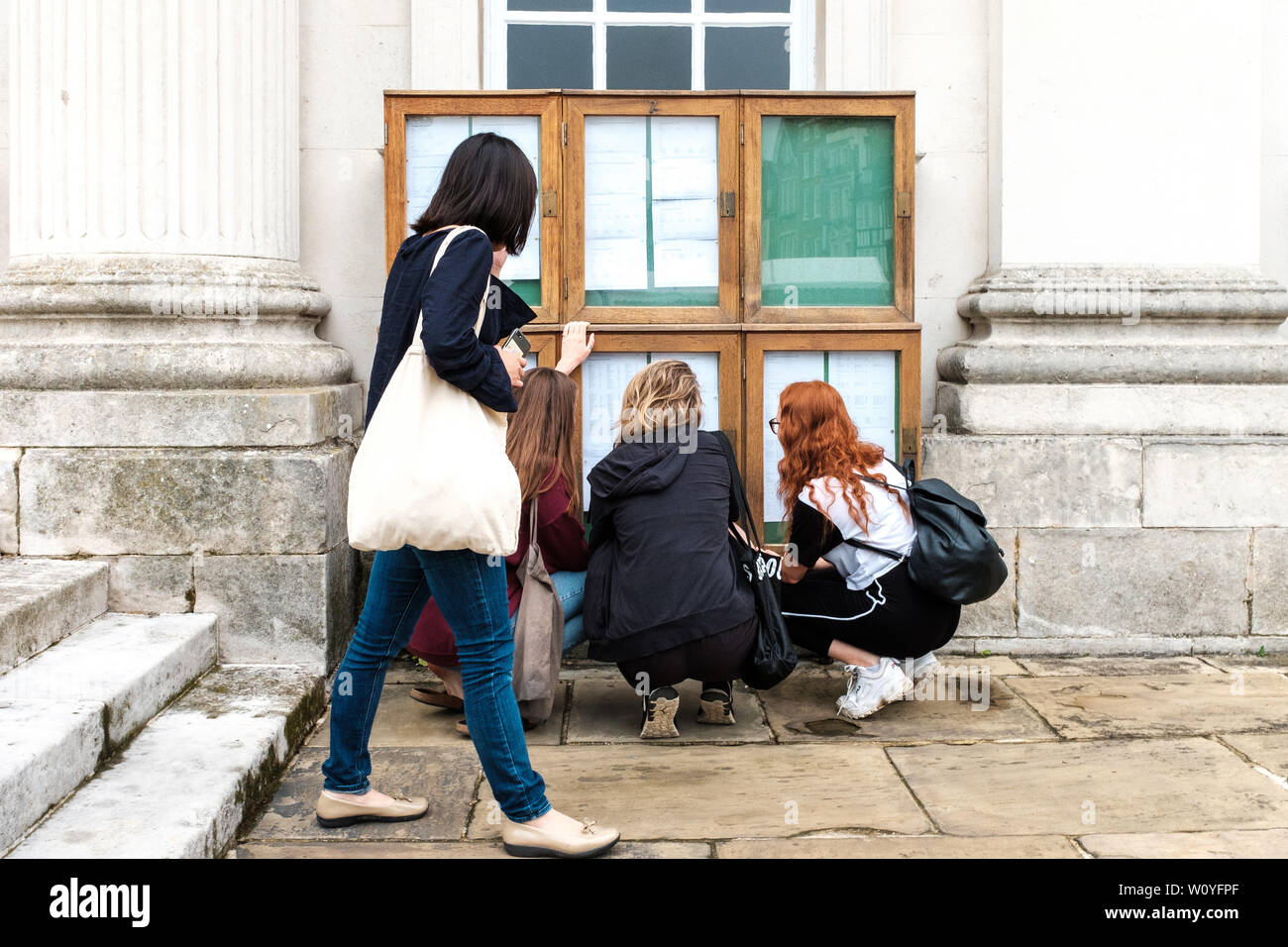 University of Cambridge students checking examination results outside Senate House. Students can opt out of having their marks published. Stock Photo