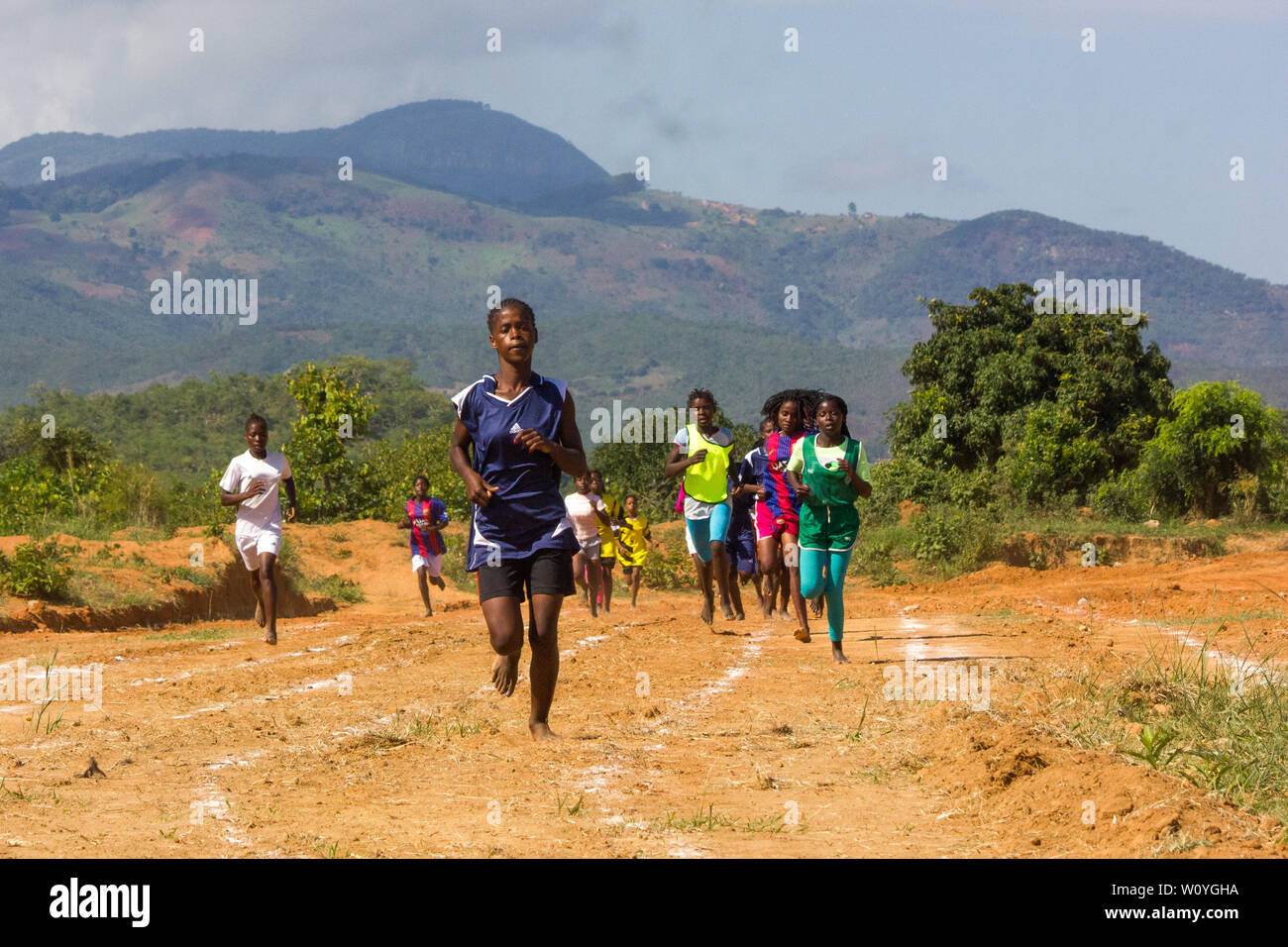 High school girls competing on a race track at the Festival of School Sports Games in Chinhamapere Secondary School Stock Photo