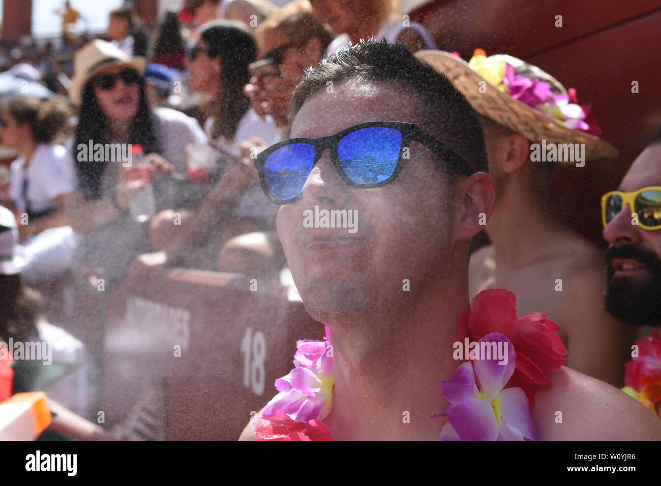 A man cools off with water as temperatures reached 36º degrees Celsius during the Viernes de Toros Celebration in Soria.The first heat wave of summer, which has claimed lives continues in Spain. Spanish's weather agency AEMET forecasts show today is set to be the worst day for severe hot weather with temperatures up to 42C in several regions. Stock Photo