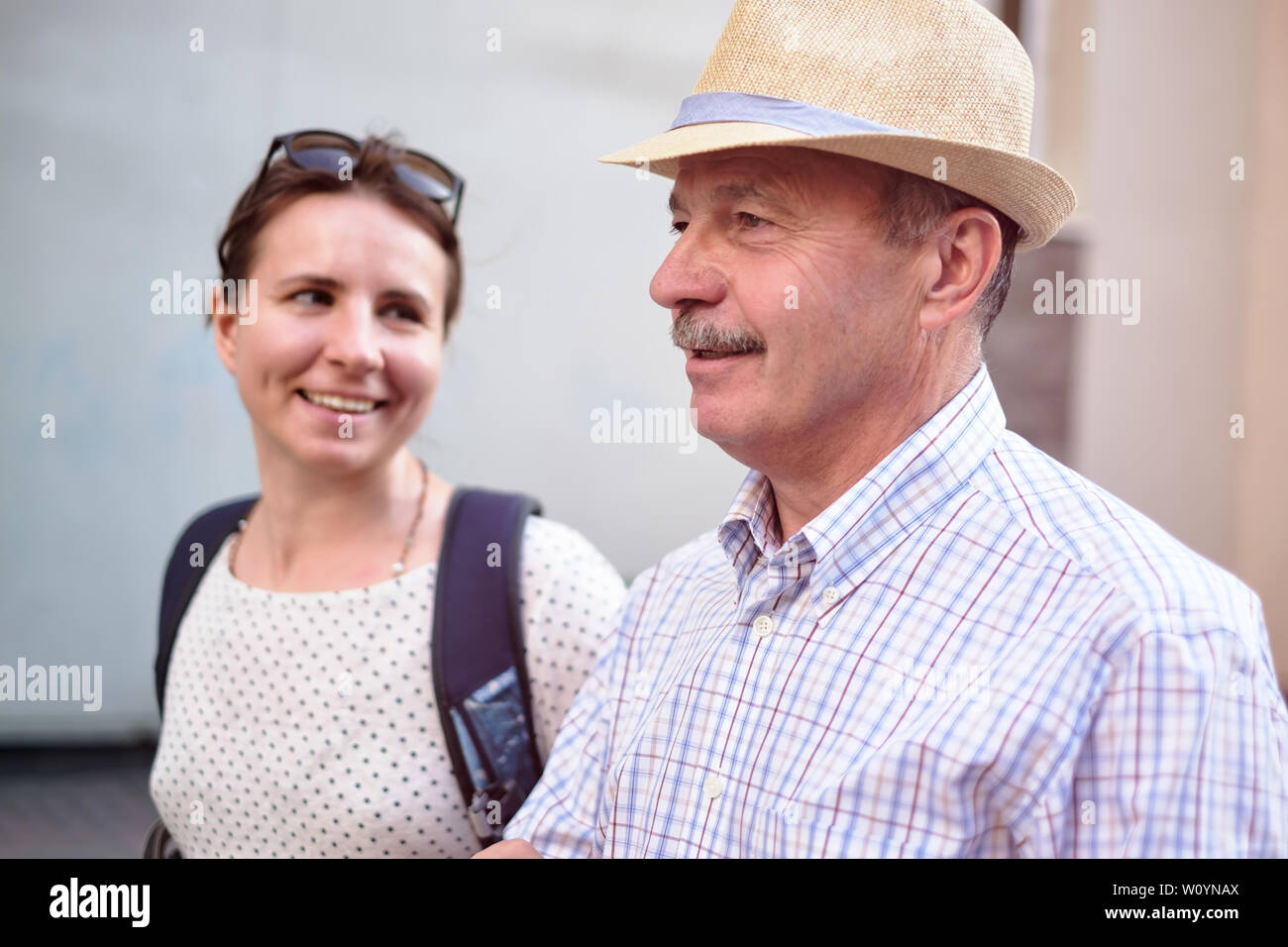 Hispanic father in summer hat and daughter walking outdoor together Stock Photo
