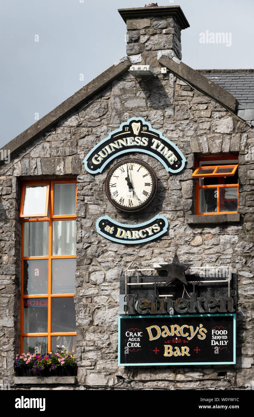 Guinness Time clock and sign outside Darcy's Bar in Galway, Ireland Stock Photo