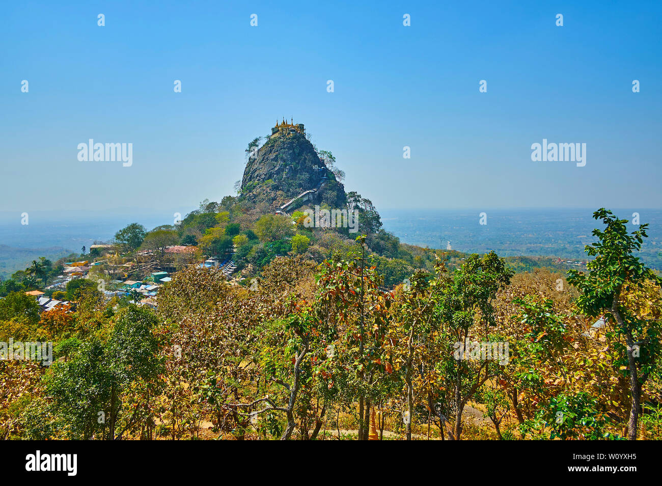 The unique landscape with tall rocky outcrop of Popa Mountain and Popa ...