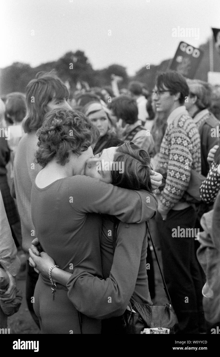 Gay Liberation Front or Gay Liberation Movement, demonstrated against the Nationwide Festival of Light. Two lesbian women in an embrace, kissing, kiss as an act of defiance against the Festival of Light rally in Hyde Park London September 1971 Festival of Light was a Christian protest movement against the English so called Permissive Society  London Uk LGBTQ 1970s HOMER SYKES Stock Photo