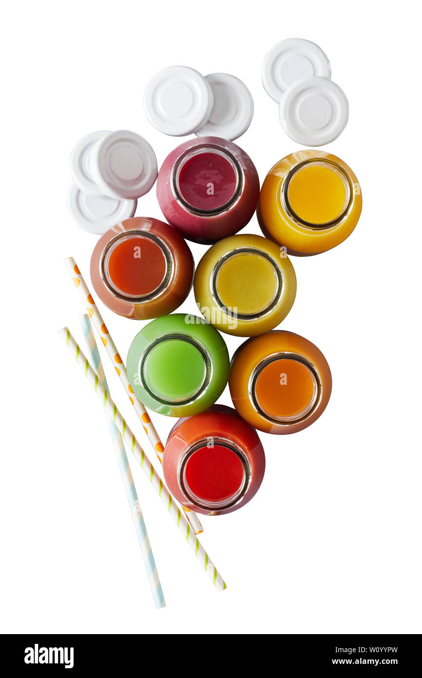 Top down view on multiple jars of nutritious fruit juice and colorful straws over plain white background Stock Photo