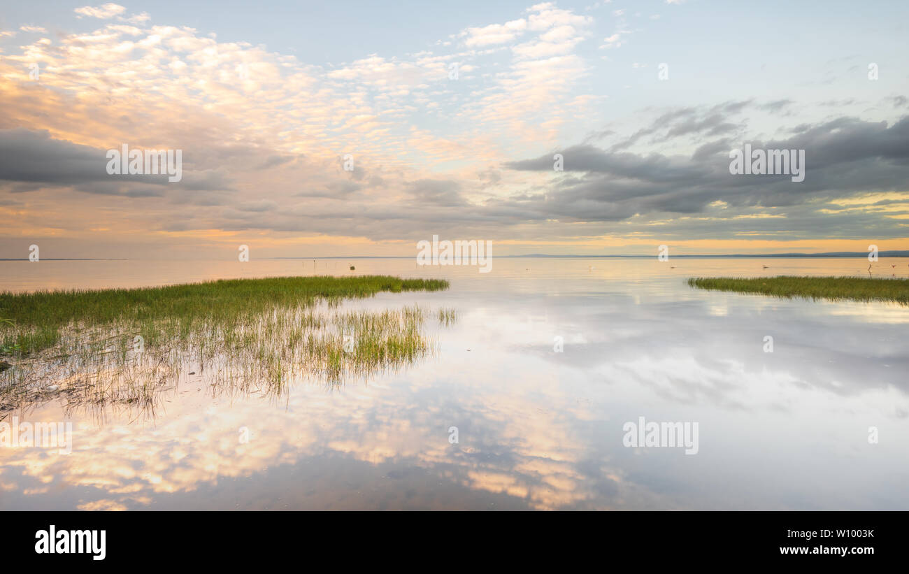 Reflections on the becalmed waters of Lough Neagh, County Armagh, Northern Ireland Stock Photo