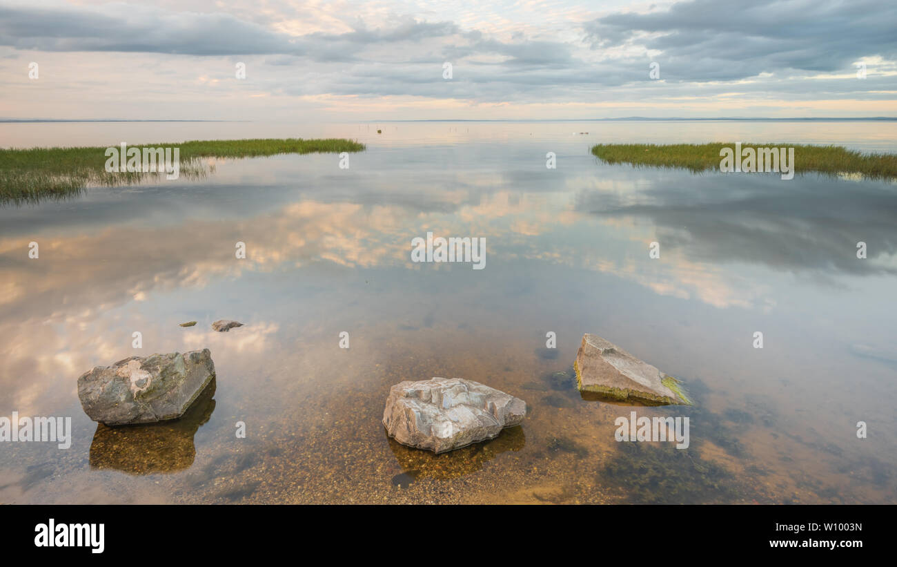 Reflections on the becalmed waters of Lough Neagh, County Armagh, Northern Ireland Stock Photo