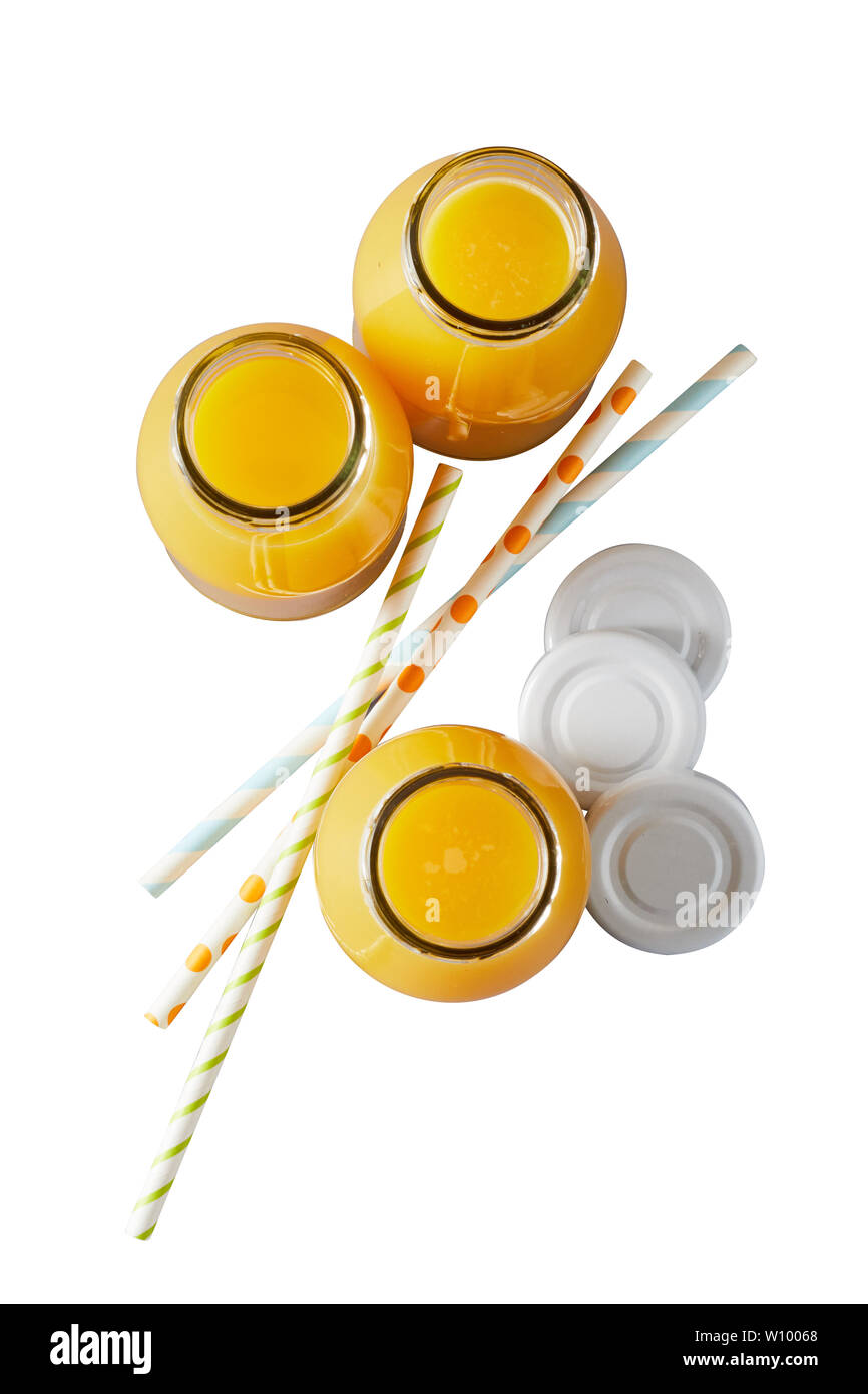 Three recyclable glass bottles of freshly squeezed orange juice rich in