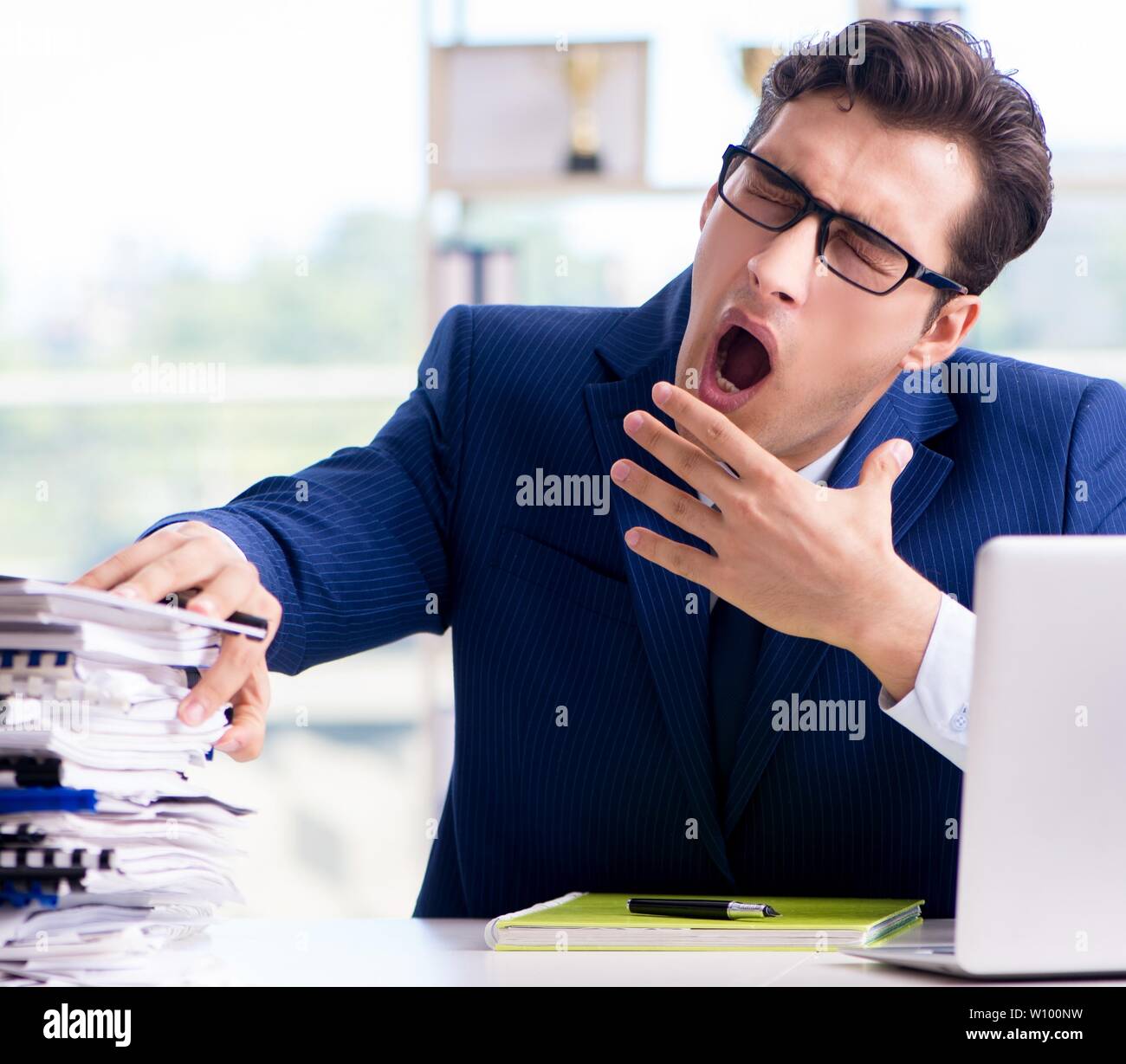 Tired businessman exhausted after hard work and excessive workload ...