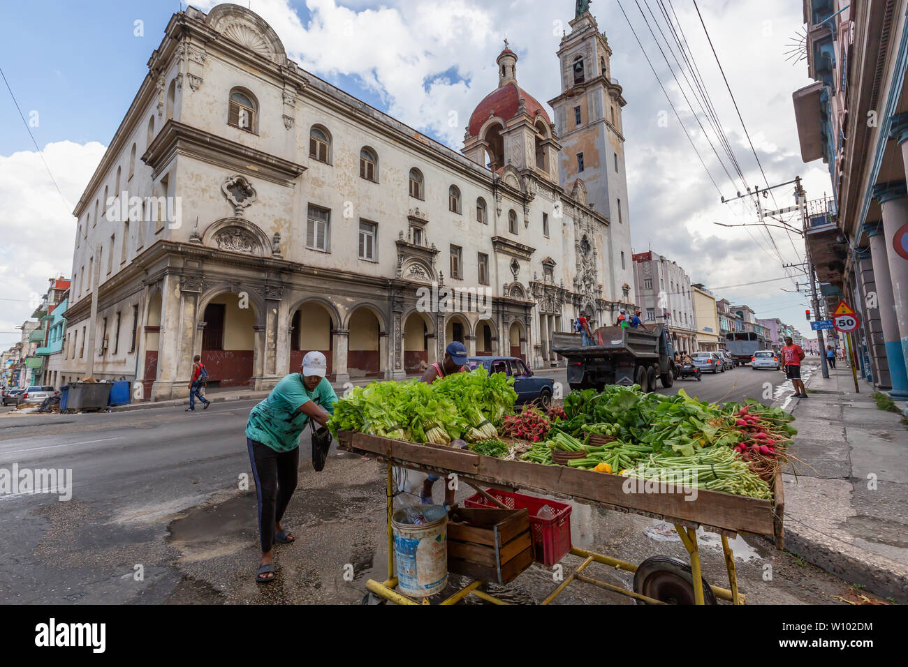 Havana, Cuba - May 14, 2019: Vendor selling Green Vegetables in the streets of Old Havana City during a cloudy day. Stock Photo