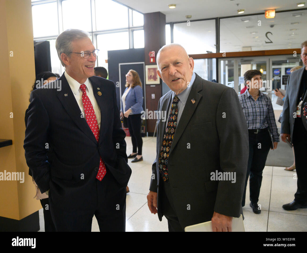 Retired Apollo 11 Flight Director Gene Kranz, right, walks with Texas Congressman Dr. Brian Babin as dignitaries gather in the restored Mission Control at NASA outside Houston to dedicate its restoration in honor of the 50th anniversary of Apollo 11's 1969 moon landing. Stock Photo