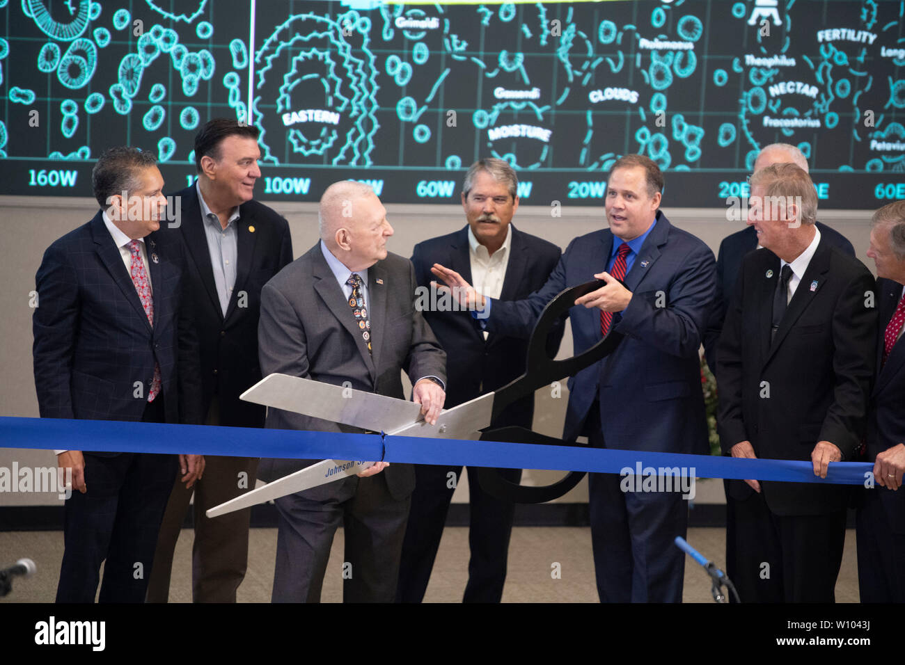 Dignitaries gather in the Mission Control Center at NASA's Johnson Space Center near Houston to dedicate the control center's restoration, which coincides with the 50th anniversary of Apollo 11's historic 1969 moon landing. Stock Photo