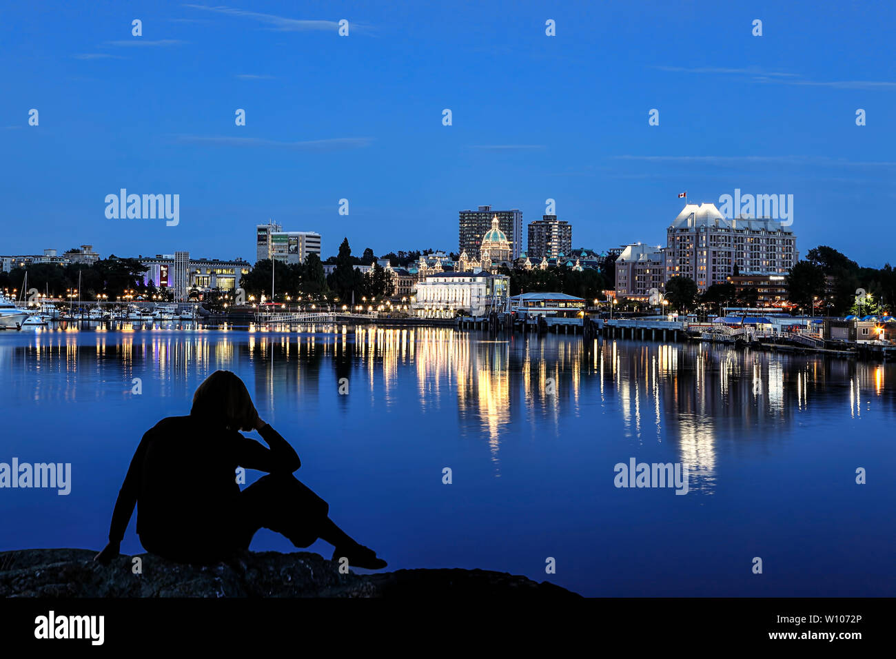 Overlooking the inner harbor at dusk in Victoria BC, Canada. Stock Photo