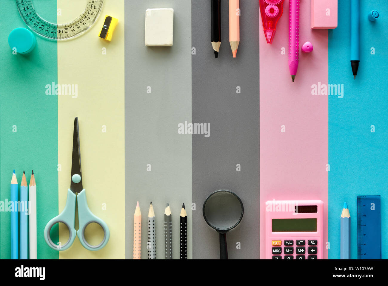 Back to school, concept flat lay background in pastel colors. Stationary items on paper background, text space. Stock Photo