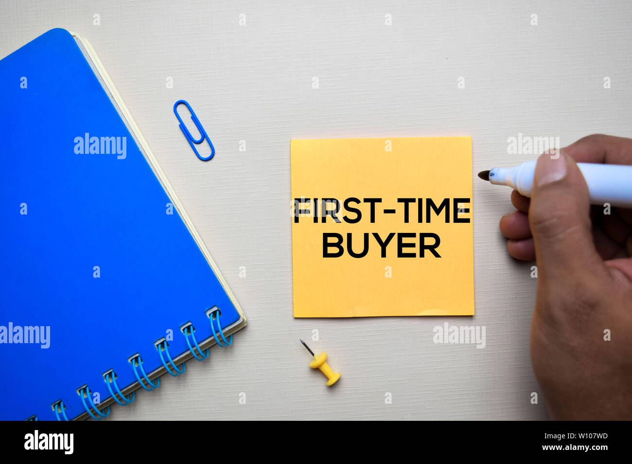 First Time Buyer text on sticky notes with office desk concept Stock Photo