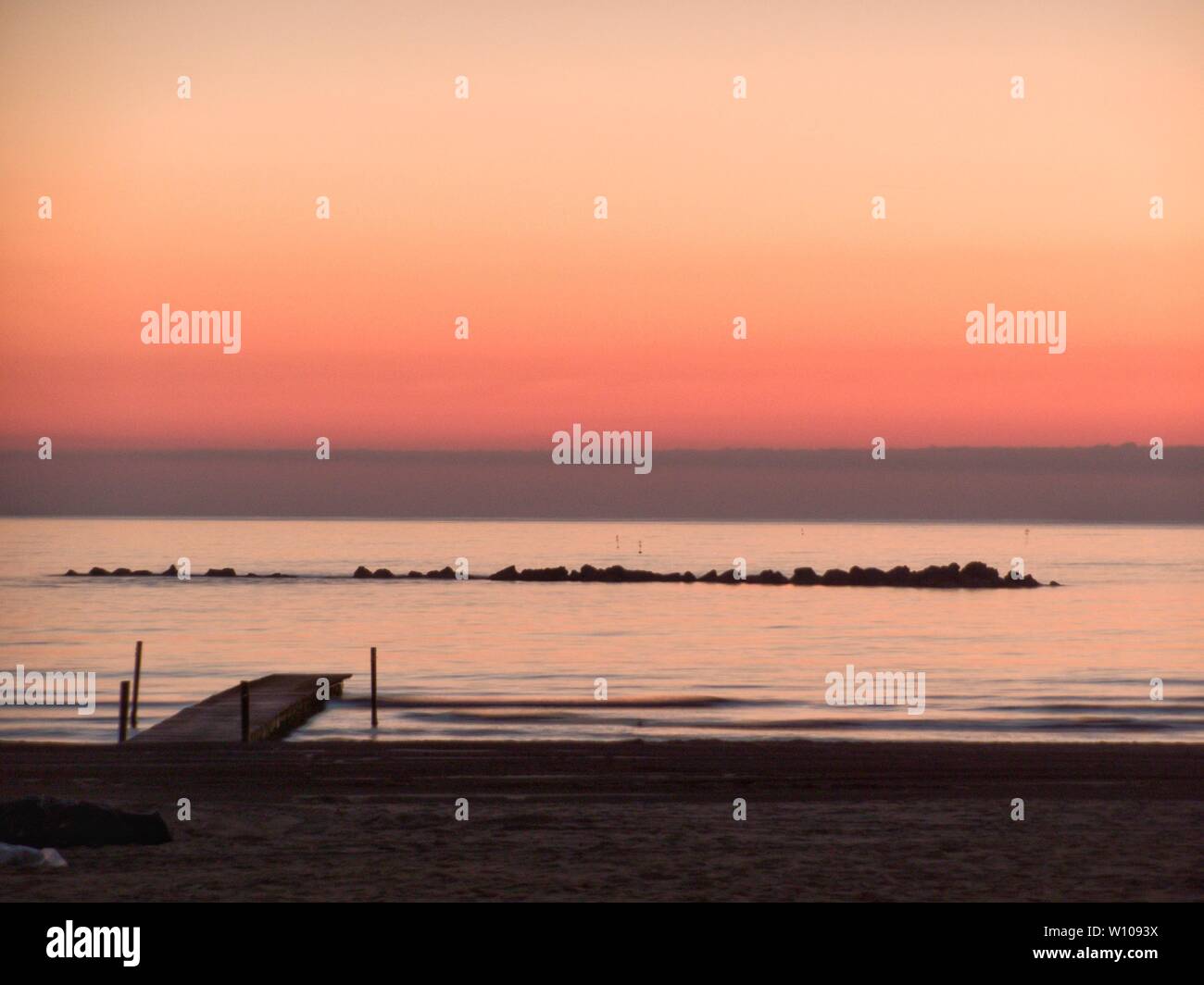 soft lights at a dawn on the Adriatic Sea, Pescara, Italy. Stock Photo