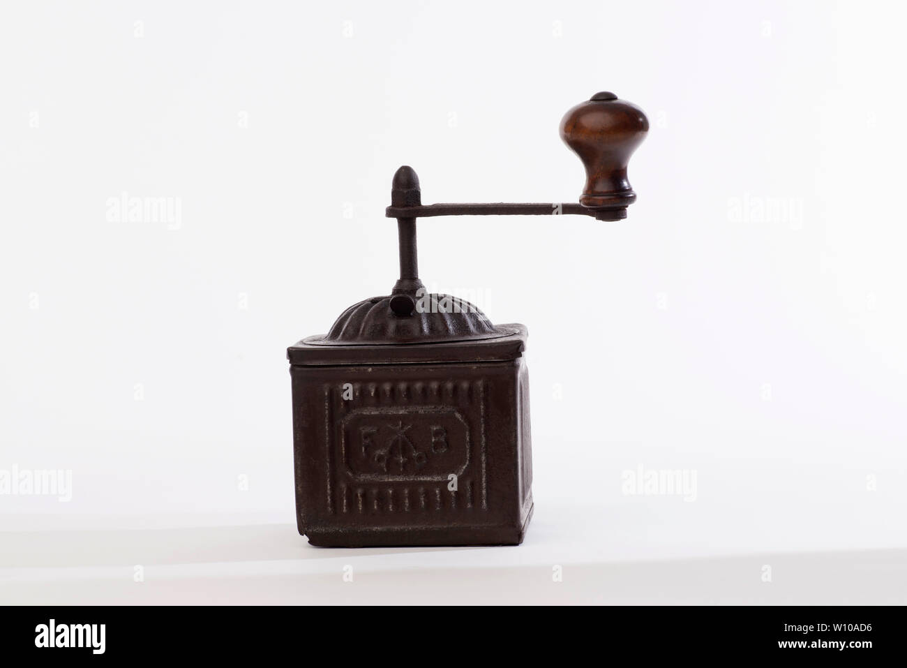 Pepper grinder, Vintage brass pepper mill isolated on white background