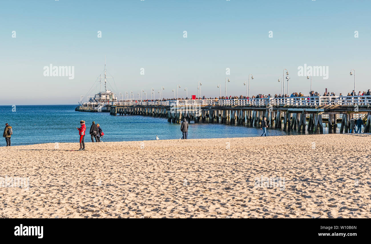 Sopot, Poland - Feb 16, 2019: People walking on the pier at Baltic sea in the tourist town of Sopot in Poland Stock Photo