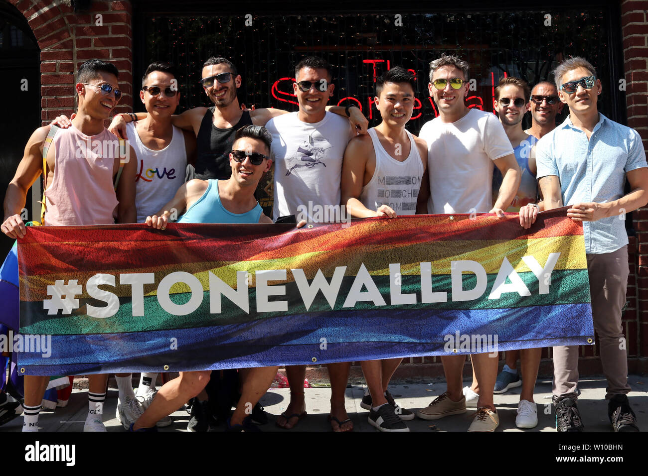 New York, NY, USA. 28th. June, 2019.  Large crowds of local and foreign gays descended upon the Stonewall Inn in New York's Greenwich Village on World Pride weekend, 28 June, 2019. On this day, 50-years-ago, the New York Police Department (NYPD) raided the neighborhood gay bar sparking a riot that lead to the modern-day gay-rights movement. © 2019 G. Ronald Lopez/Alamy Live News Stock Photo