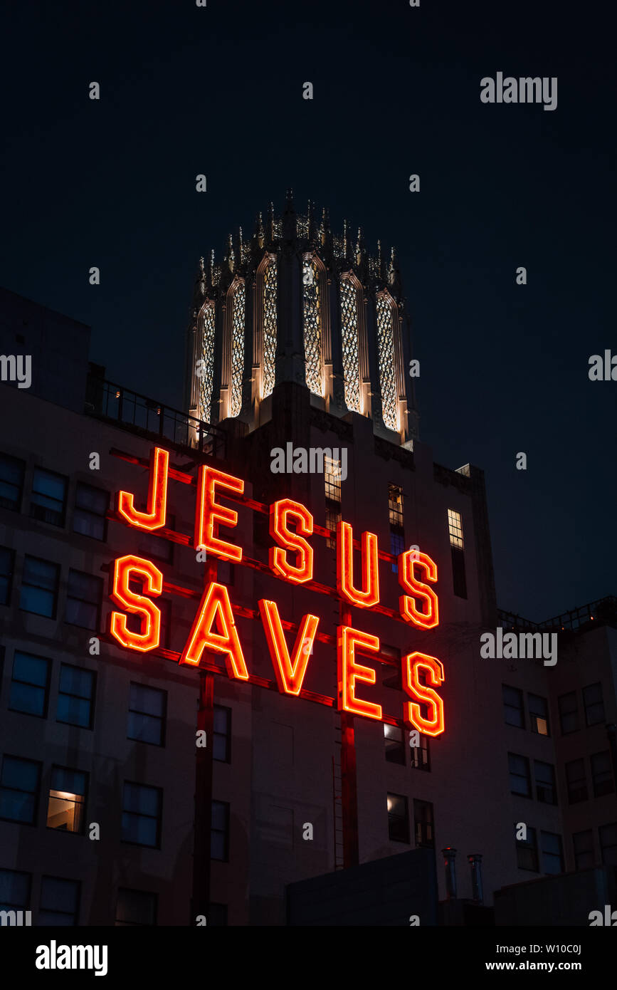 Jesus Saves sign at night, in downtown Los Angeles, California Stock
