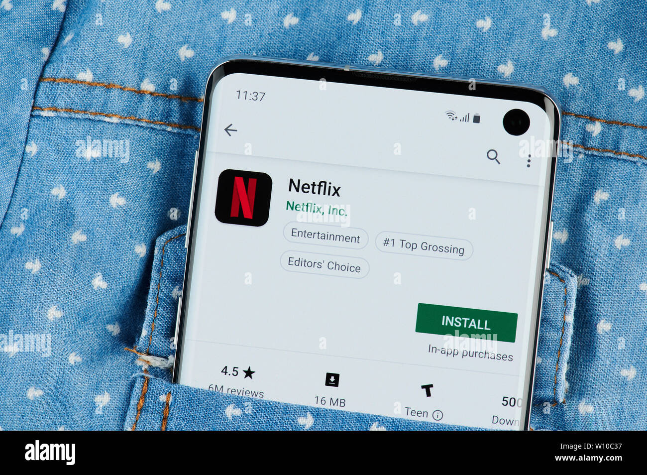 New york, USA - June 28, 2019: Netflix application on smartphone screen close up view in shirt pocket Stock Photo