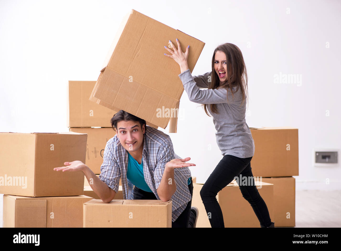 The young pair moving to new flat Stock Photo - Alamy