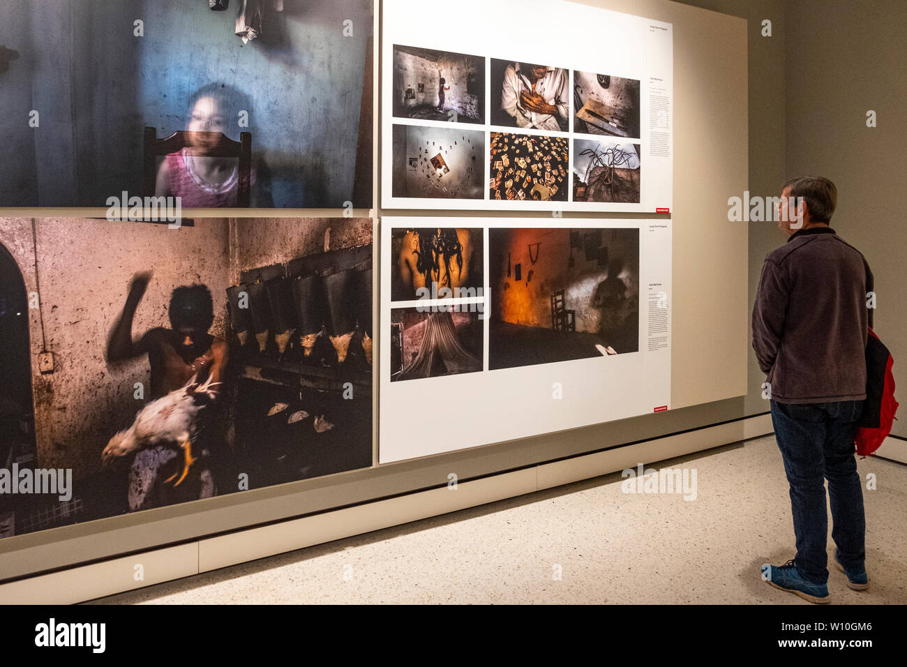 Visitors at the 2019 World Press Photo exhibition inside the State Library of NSW in Sydney, Australia. Stock Photo