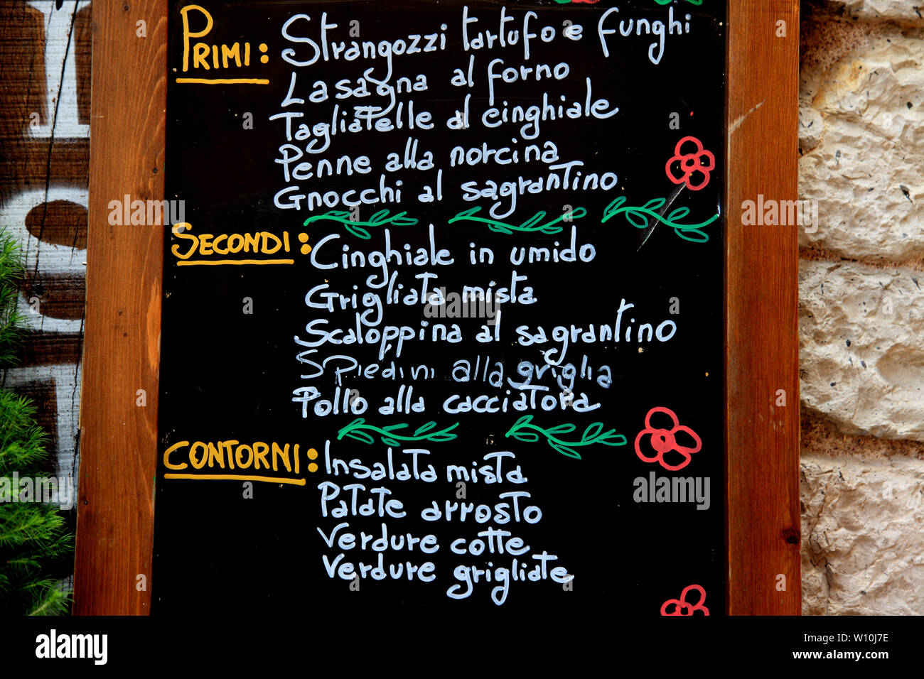 Menu outside a restaurant in Umbria Italy Stock Photo