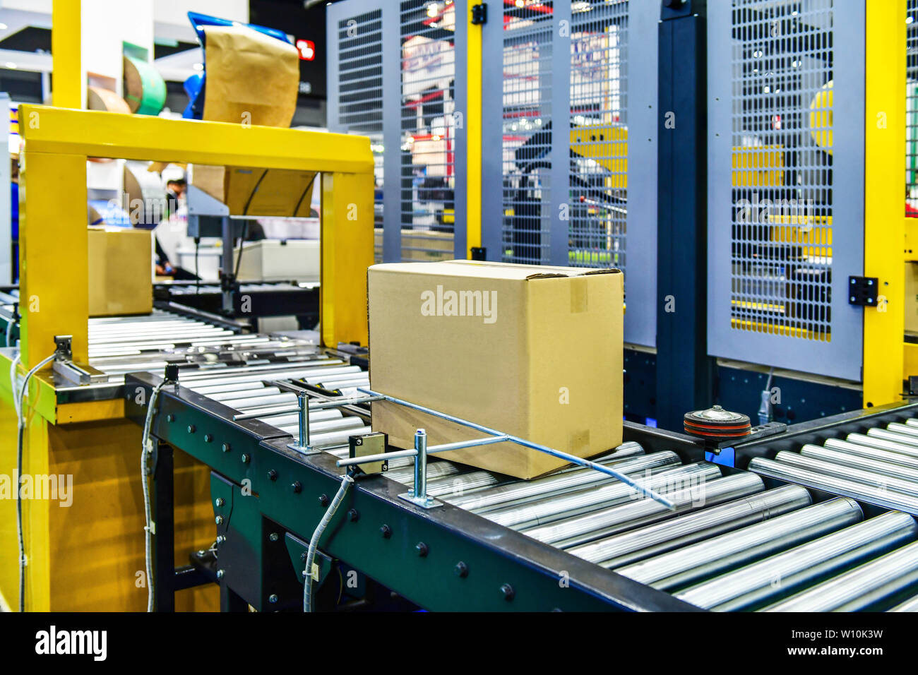 Cardboard boxes on conveyor belt in distribution warehouse.parcels