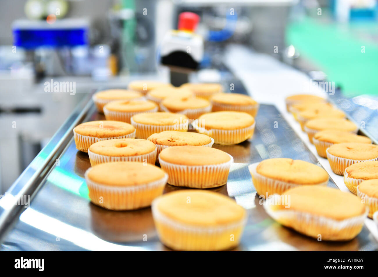 Automatic Bakery Muffins Production Line On Conveyor Belt Equipment Machinery In Factory Industrial Food Production Stock Photo Alamy