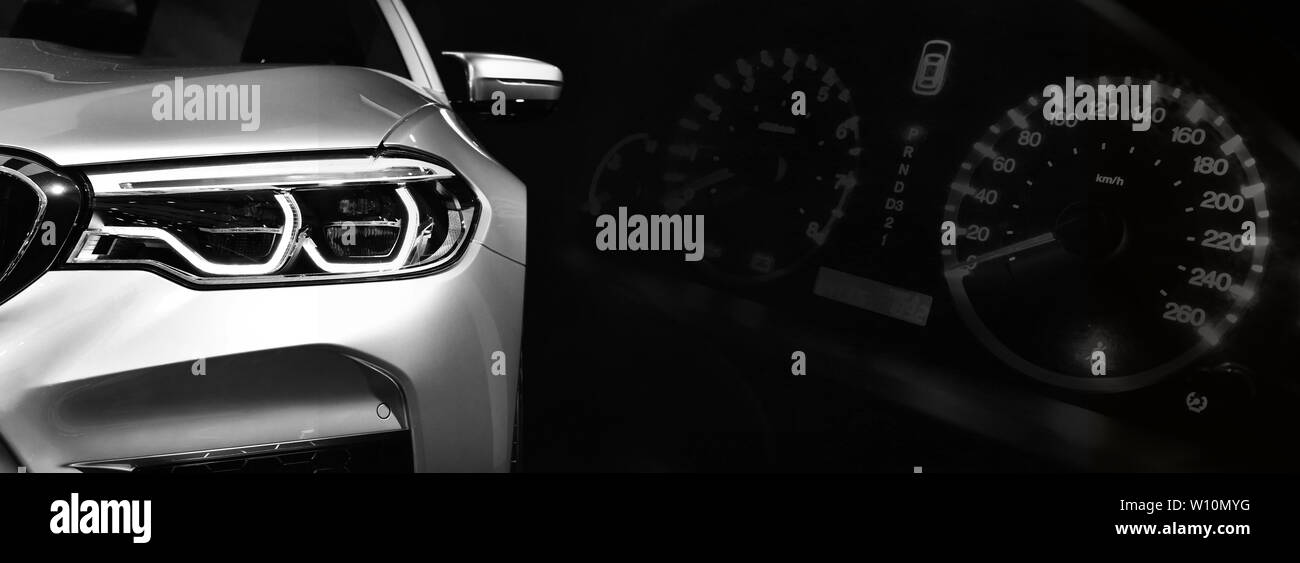Gray modern car headlights on car instrument panel background Stock Photo