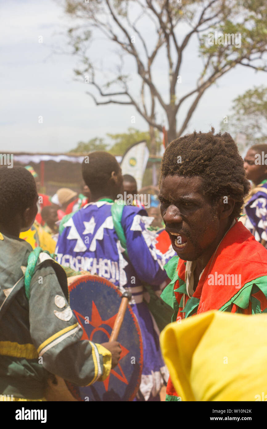 African men from Sent Luke's Apostolic Ejuwel Jekenisheni Church  dancing and playing strap drums Stock Photo